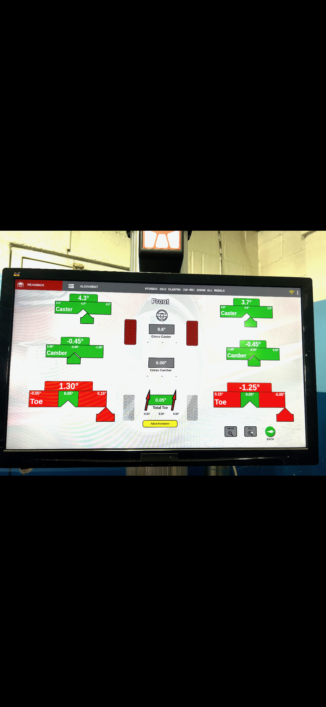 Engine diagnostic scan tool reading vehicle fault codes during a check-engine light diagnosis