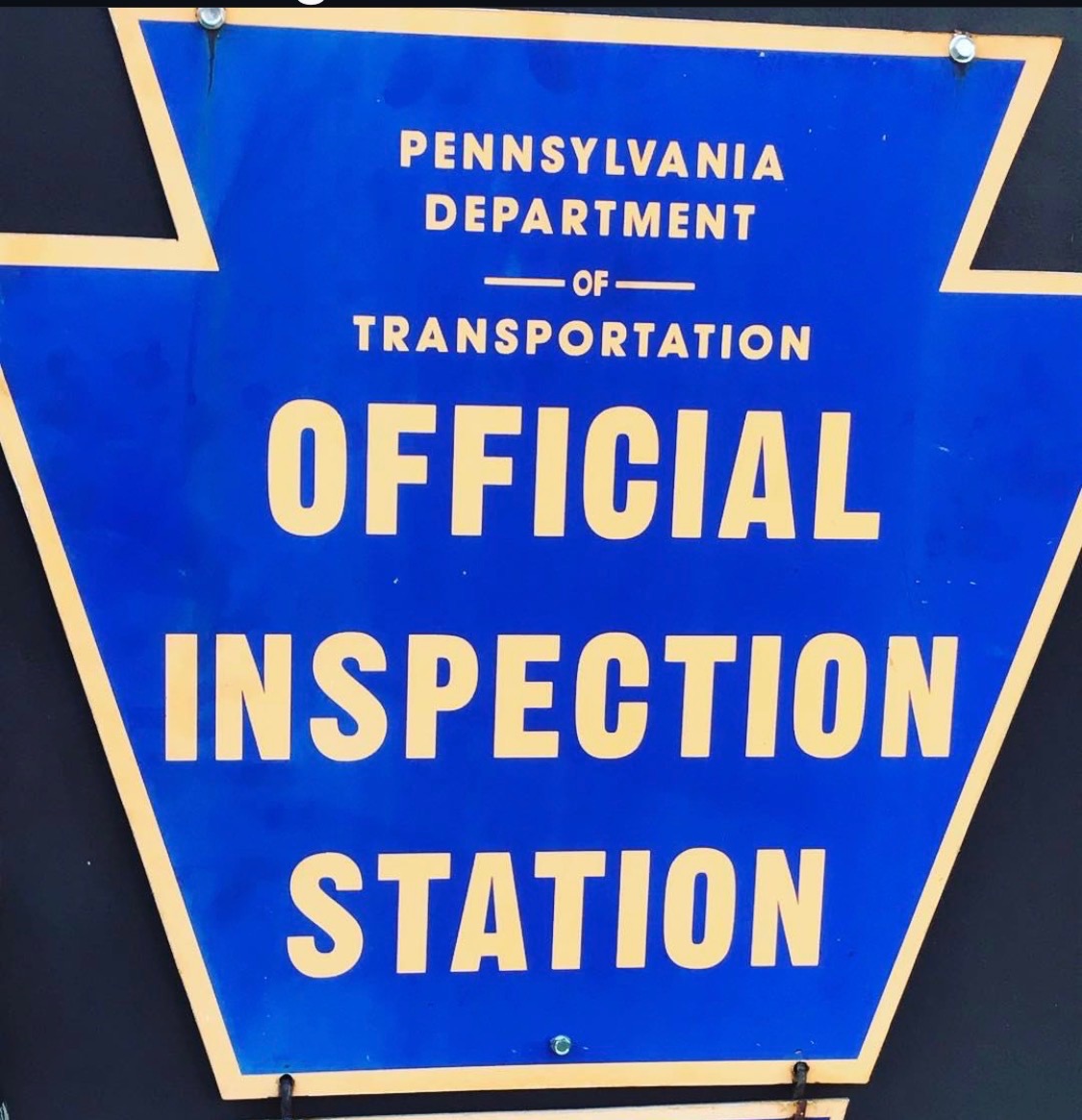 Pennsylvania Department of Transportation Official Inspection Station sign at Foreign Fix Auto Center